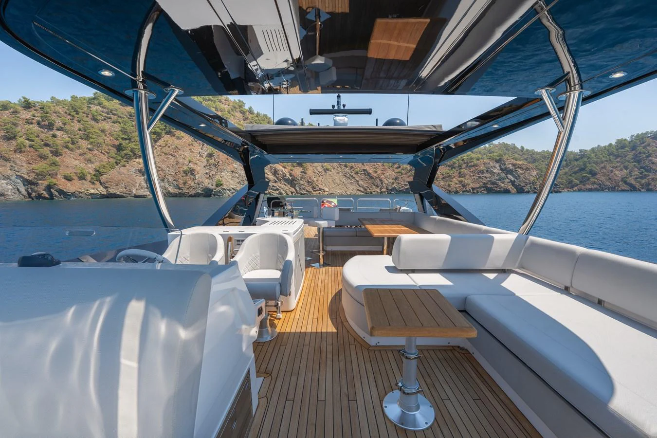 The flybridge offers a spacious and luxurious outdoor seating area with stunning views of the surrounding waters. aboard NAAMA Yacht for Sale