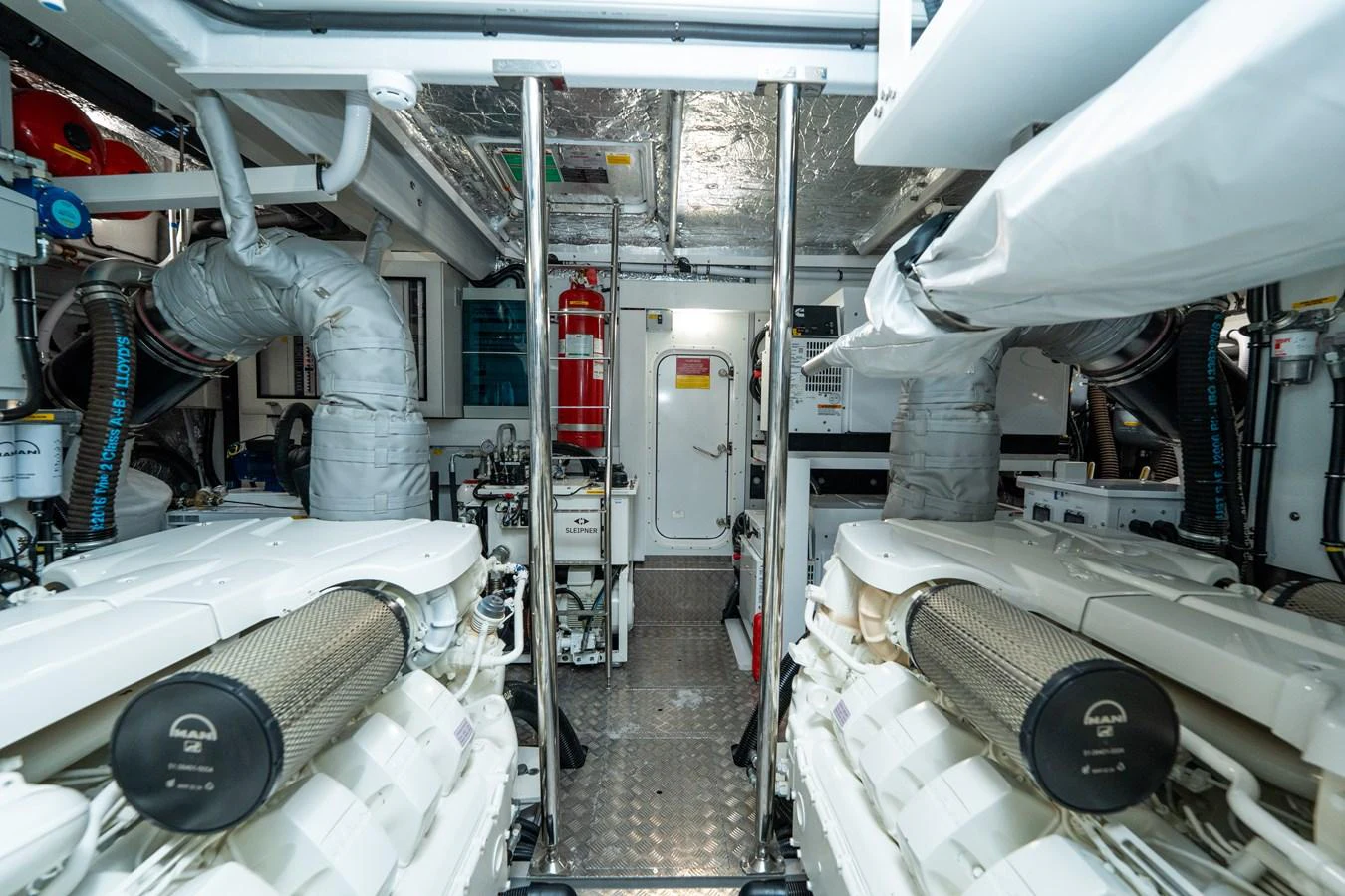 The image showcases the well-maintained engine room of the yacht, highlighting its advanced machinery and clean setup. aboard NAAMA Yacht for Sale