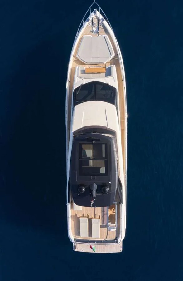 Aerial view of a sleek yacht cruising on deep blue waters. aboard ABIGAIL Yacht for Sale