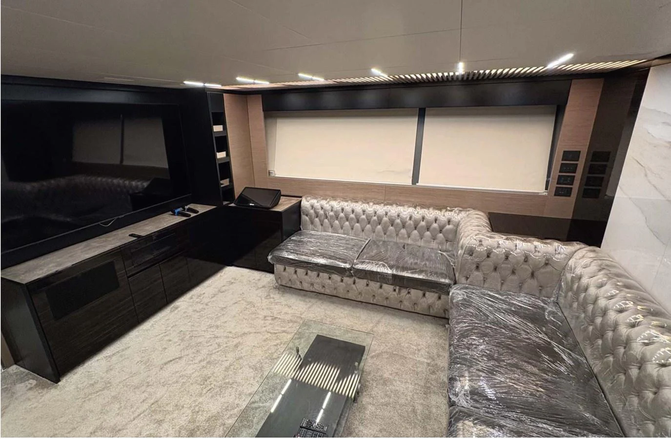 The salon features plush seating and a large flat-screen TV, creating a comfortable and luxurious space for relaxation. aboard ABIGAIL Yacht for Sale