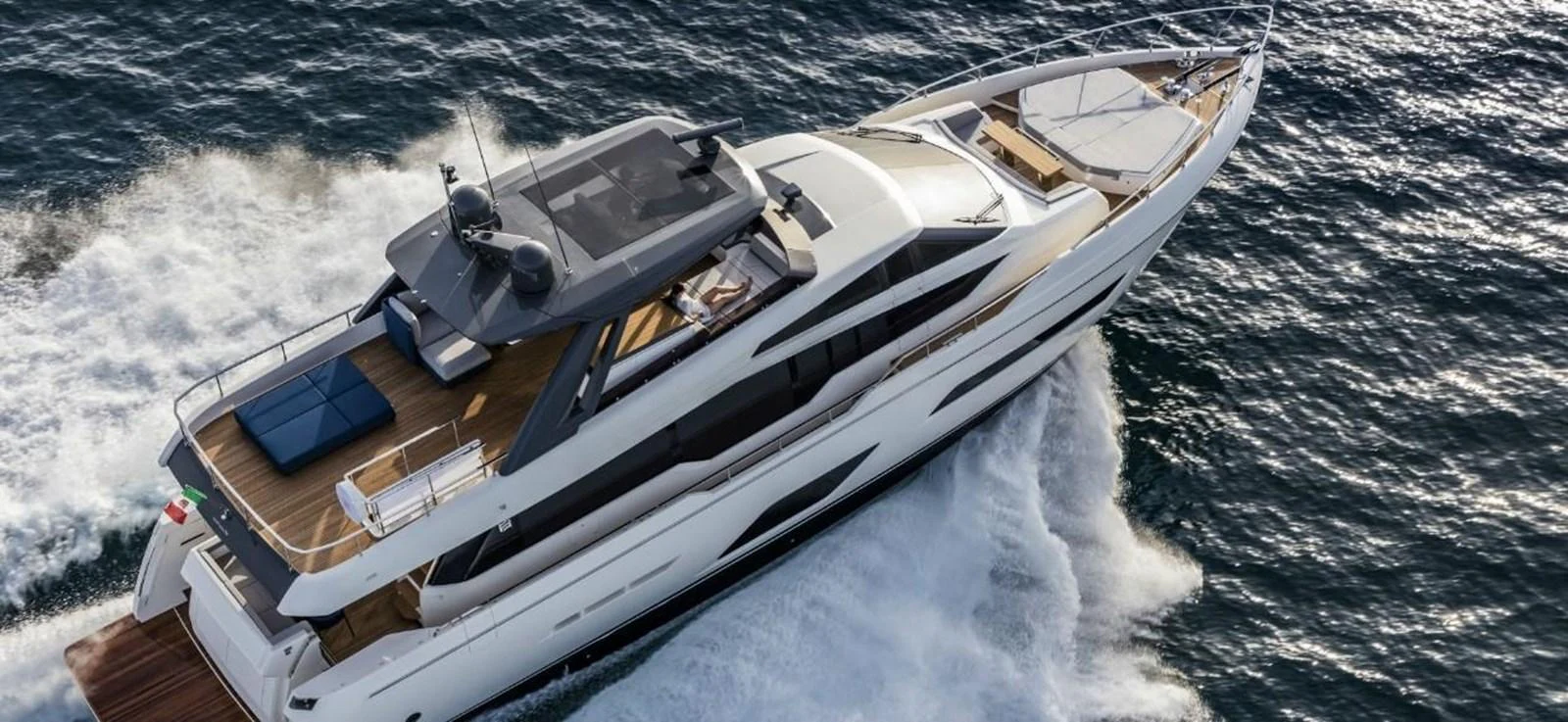 A sleek and modern yacht cruises swiftly through the water, showcasing its luxurious design and spacious deck areas. aboard ABIGAIL Yacht for Sale