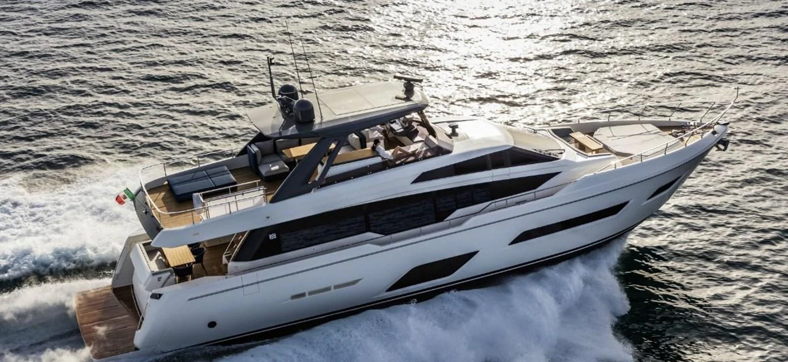 A sleek and modern yacht cruises swiftly through the water, showcasing its elegant design and luxurious amenities. aboard ABIGAIL Yacht for Sale