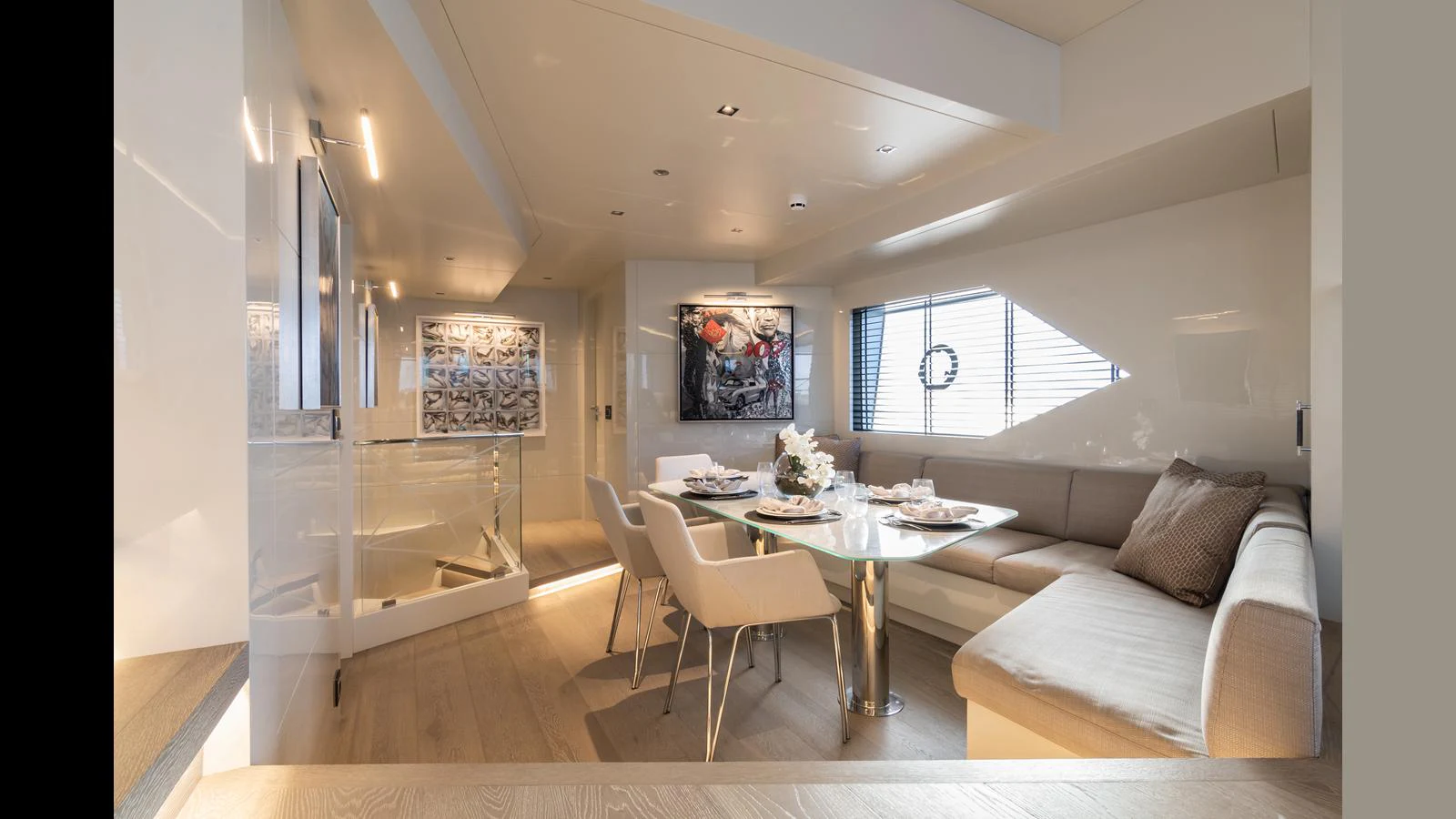 The salon features a modern and elegant dining area with ample natural light. aboard HULL #5 Yacht for Sale