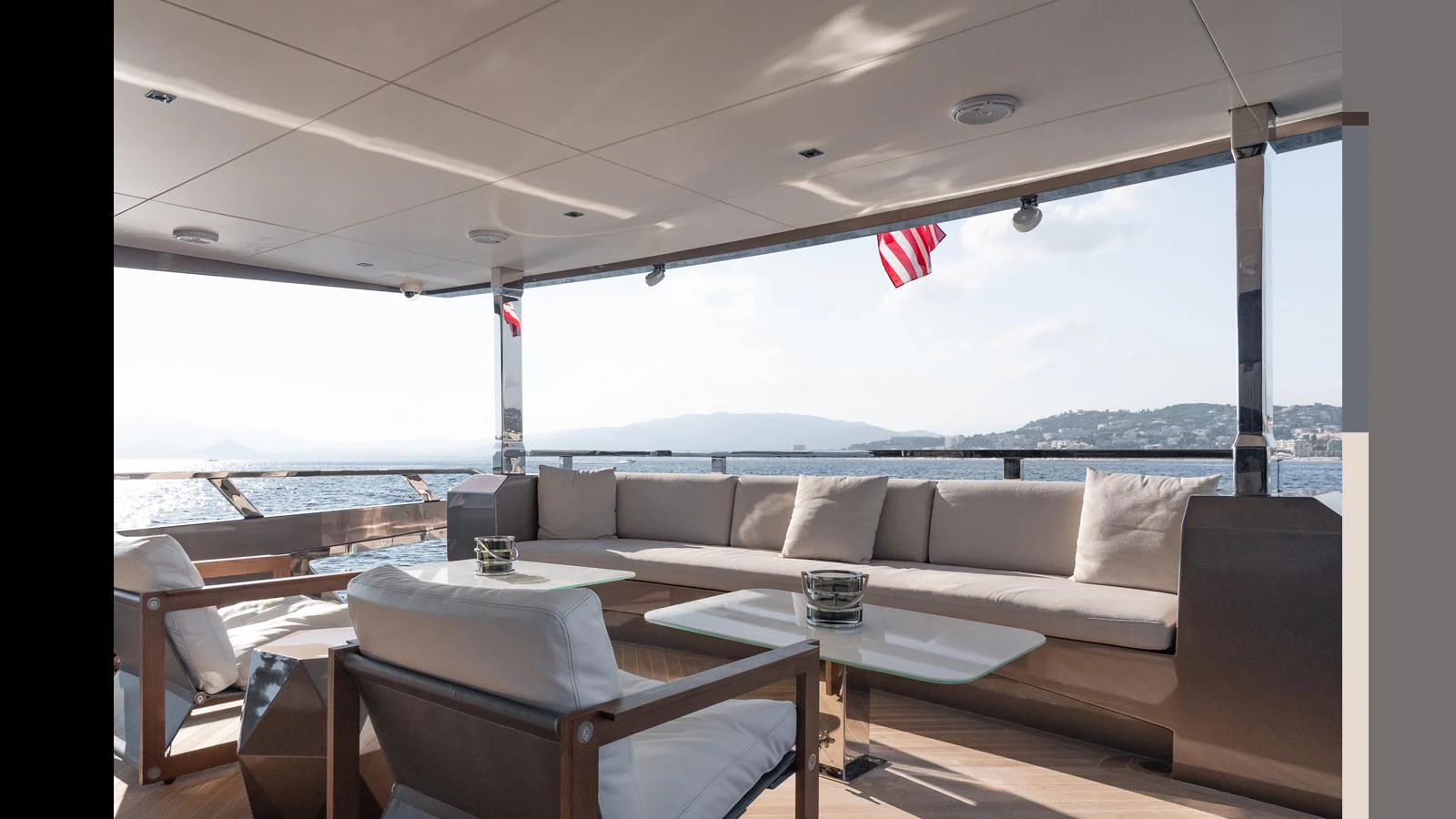 The aft deck offers a spacious and comfortable seating area with stunning views of the surrounding waters. aboard HULL #5 Yacht for Sale