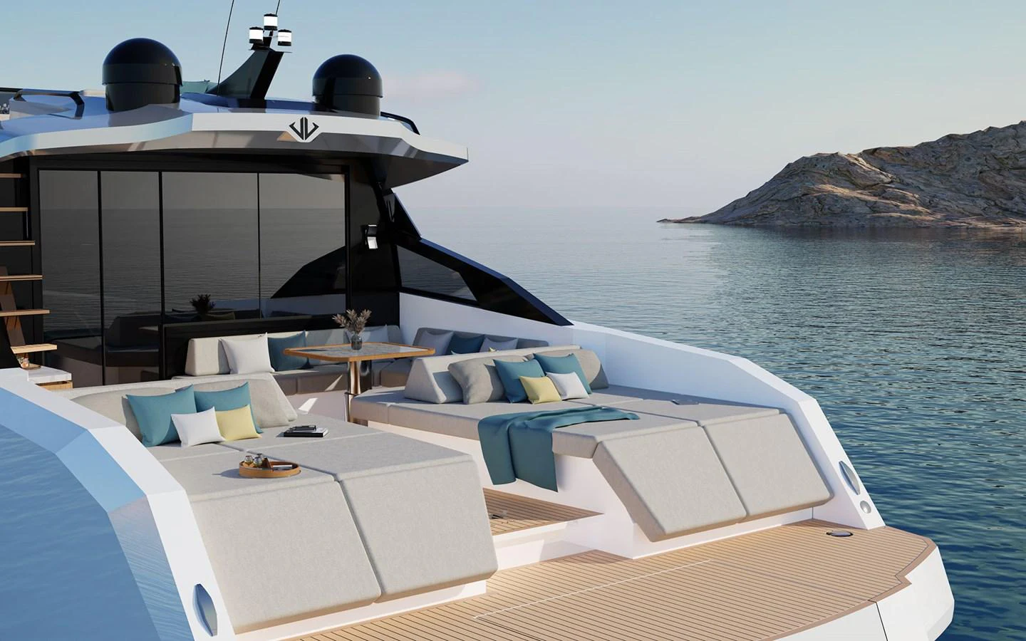 The yacht's aft deck features luxurious sun loungers and a serene view of the water and nearby island. aboard 66 Yacht for Sale
