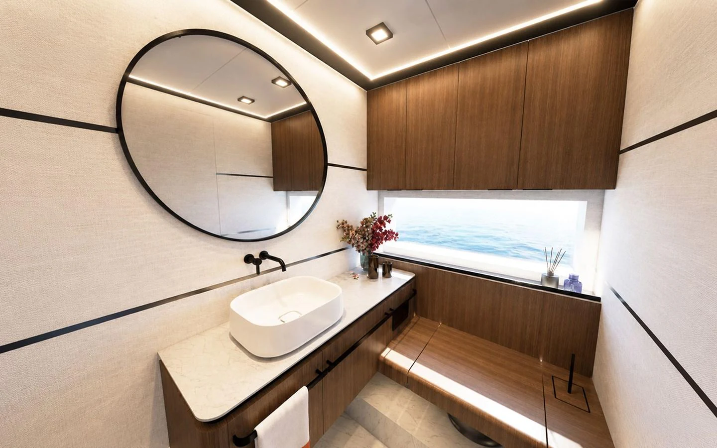 The bathroom features modern fixtures, a large mirror, and a scenic ocean view. aboard 66 Yacht for Sale