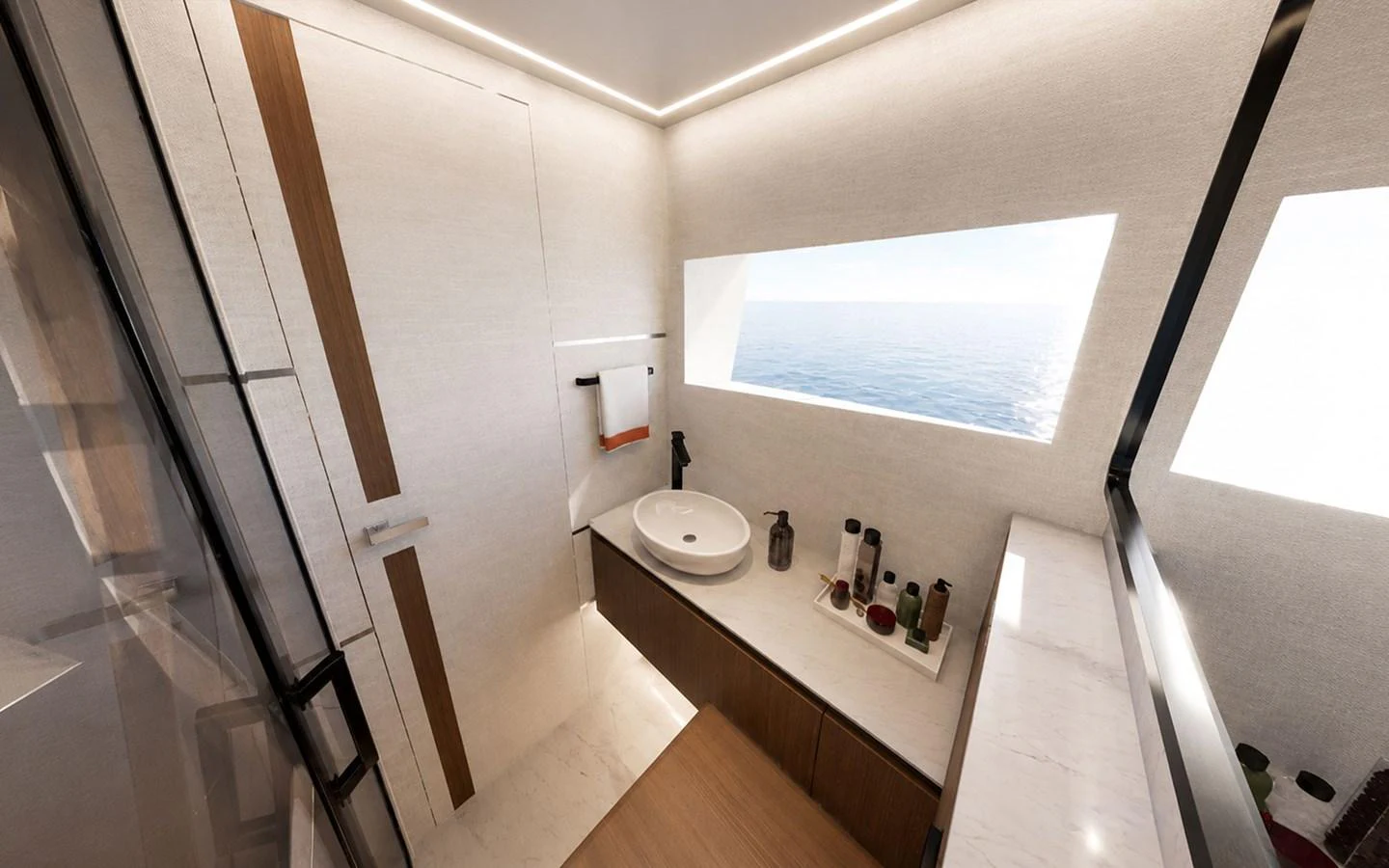 A modern and sleek bathroom with a large window offering a serene view of the sea. aboard 66 Yacht for Sale