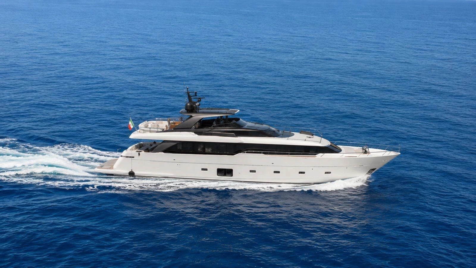 A sleek and modern yacht glides effortlessly through the open sea. aboard SAAM II Yacht for Sale