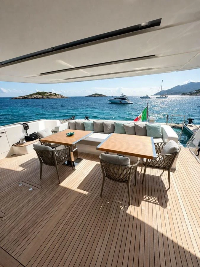 The aft deck offers a serene dining area with stunning ocean views. aboard SAAM II Yacht for Sale