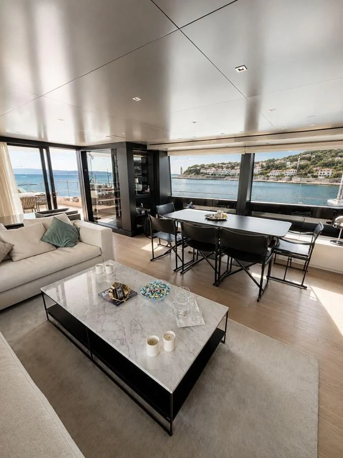 The salon offers a luxurious and spacious area with panoramic views and elegant furnishings. aboard SAAM II Yacht for Sale
