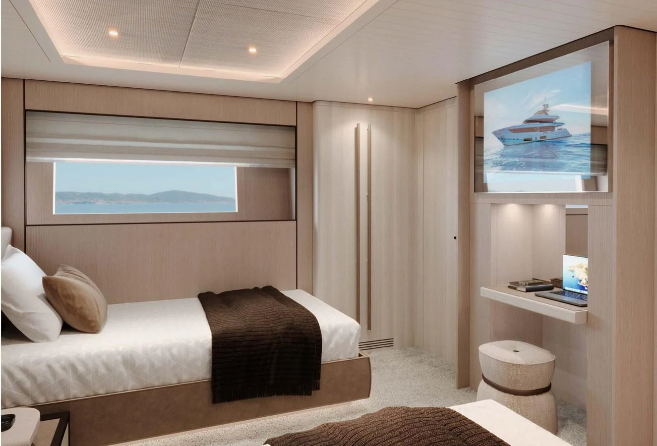The guest stateroom features twin beds, a large window, and a flat-screen TV for a comfortable stay. aboard LUMINA Yacht for Sale