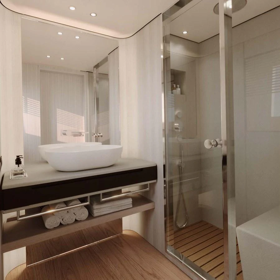 A sleek and modern bathroom featuring a glass-enclosed shower and elegant fixtures. aboard LUMINA Yacht for Sale