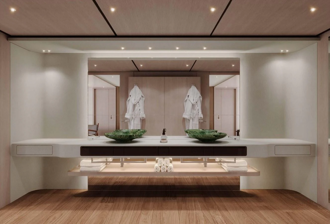 The bathroom features a modern design with dual sinks and luxurious amenities. aboard LUMINA Yacht for Sale