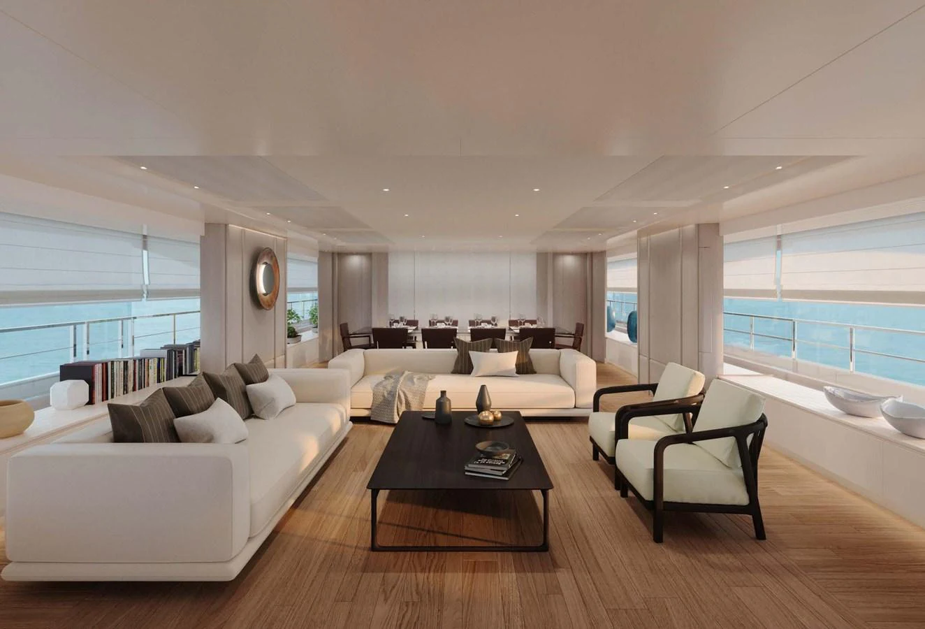 The yacht's salon features elegant seating with panoramic windows offering stunning ocean views. aboard LUMINA Yacht for Sale
