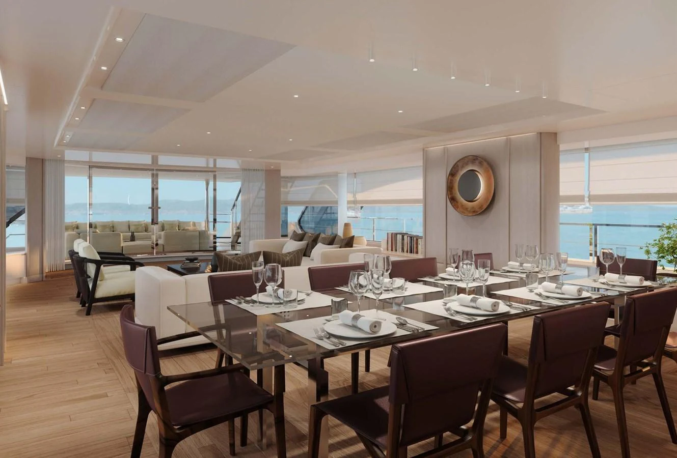 The yacht's dining area features a spacious and elegant setting with panoramic views. aboard LUMINA Yacht for Sale