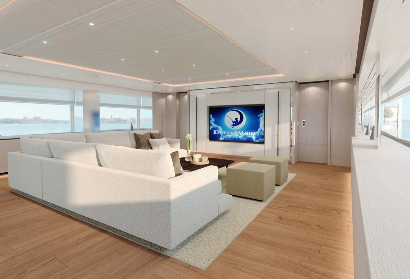 The spacious salon features a large, comfortable seating area with a modern entertainment system. aboard LUMINA Yacht for Sale