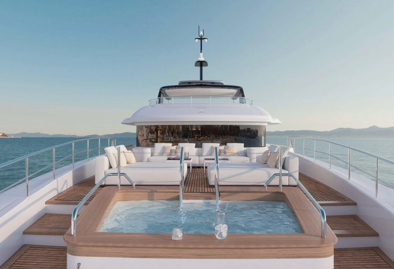 The sundeck features a luxurious jacuzzi surrounded by plush seating, offering stunning views of the sea. aboard LUMINA Yacht for Sale
