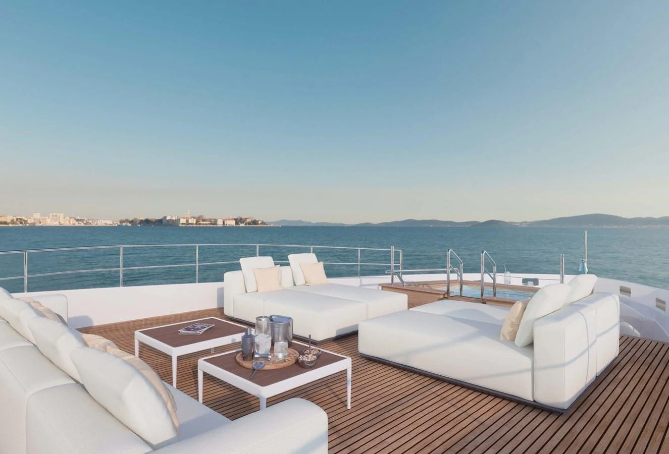 The sundeck offers a spacious and luxurious lounging area with stunning sea views. aboard LUMINA Yacht for Sale