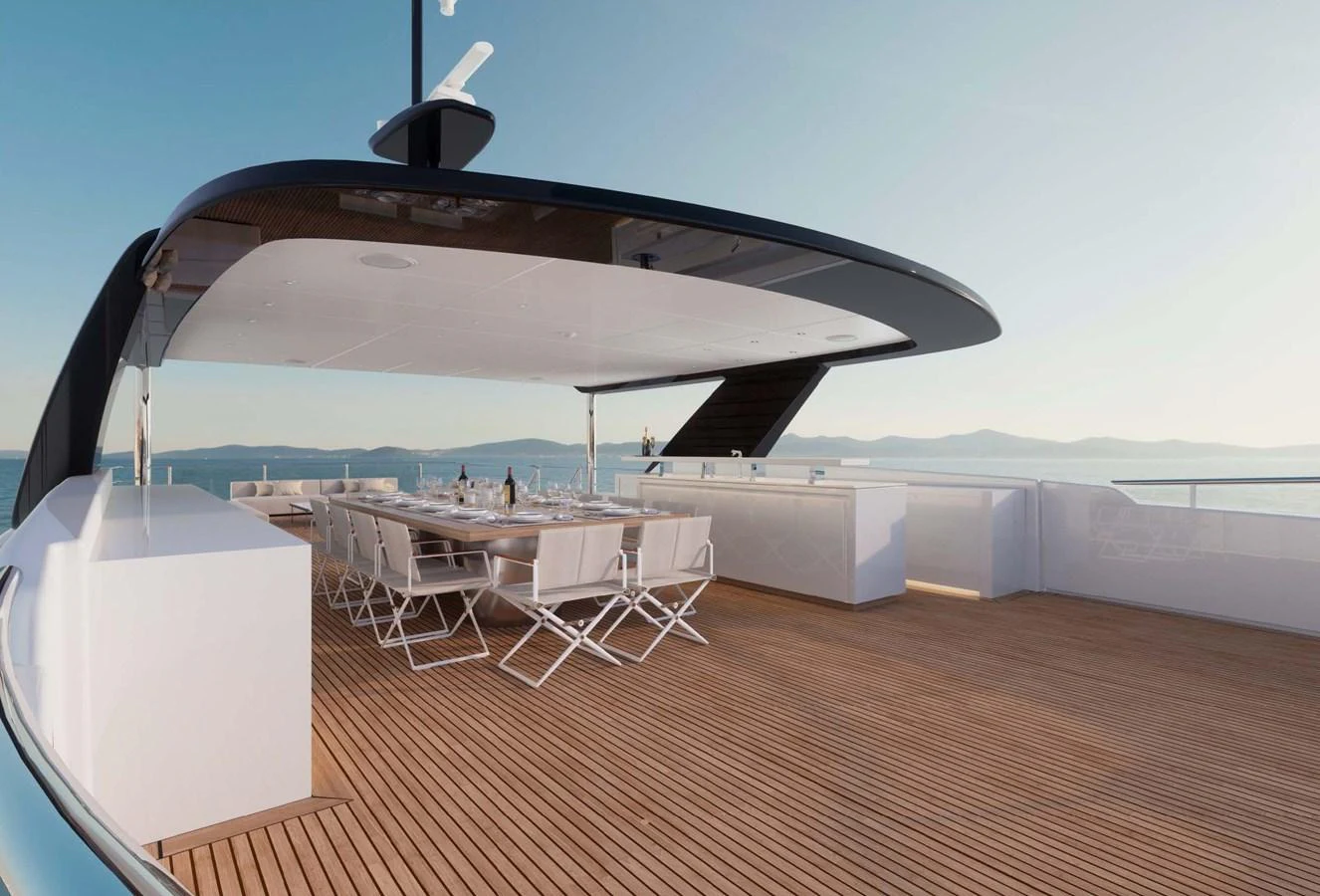 The sundeck features a spacious dining area with modern seating and panoramic views. aboard LUMINA Yacht for Sale