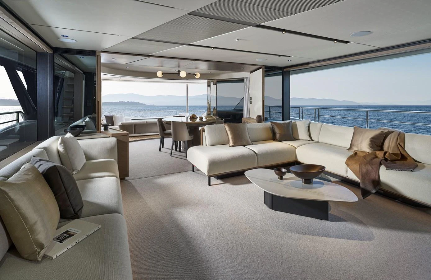 The spacious salon offers panoramic views and luxurious seating arrangements. aboard PRINCESS X90 Yacht for Sale