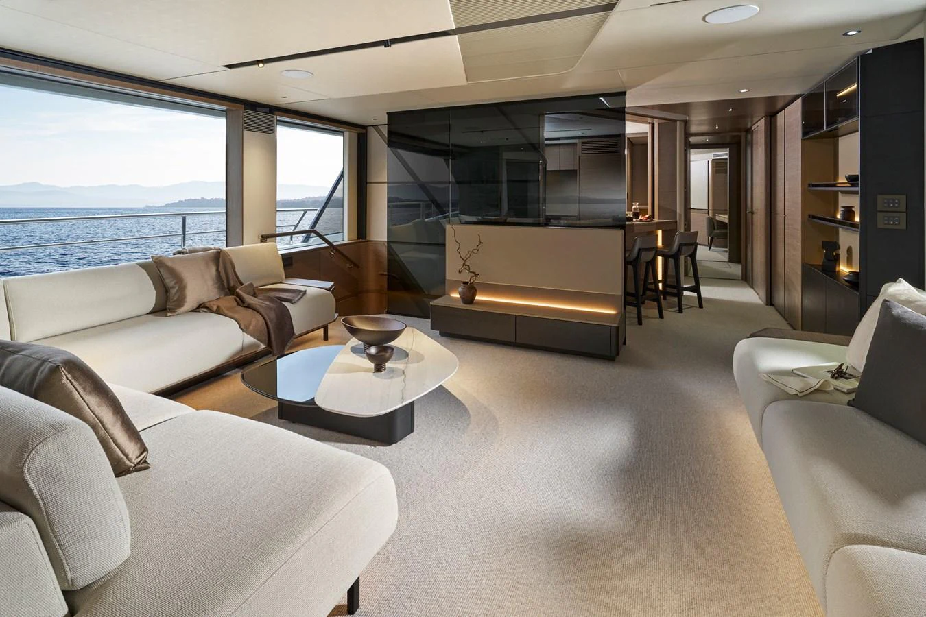 The salon offers a spacious and elegant area with modern furnishings and panoramic views. aboard PRINCESS X90 Yacht for Sale