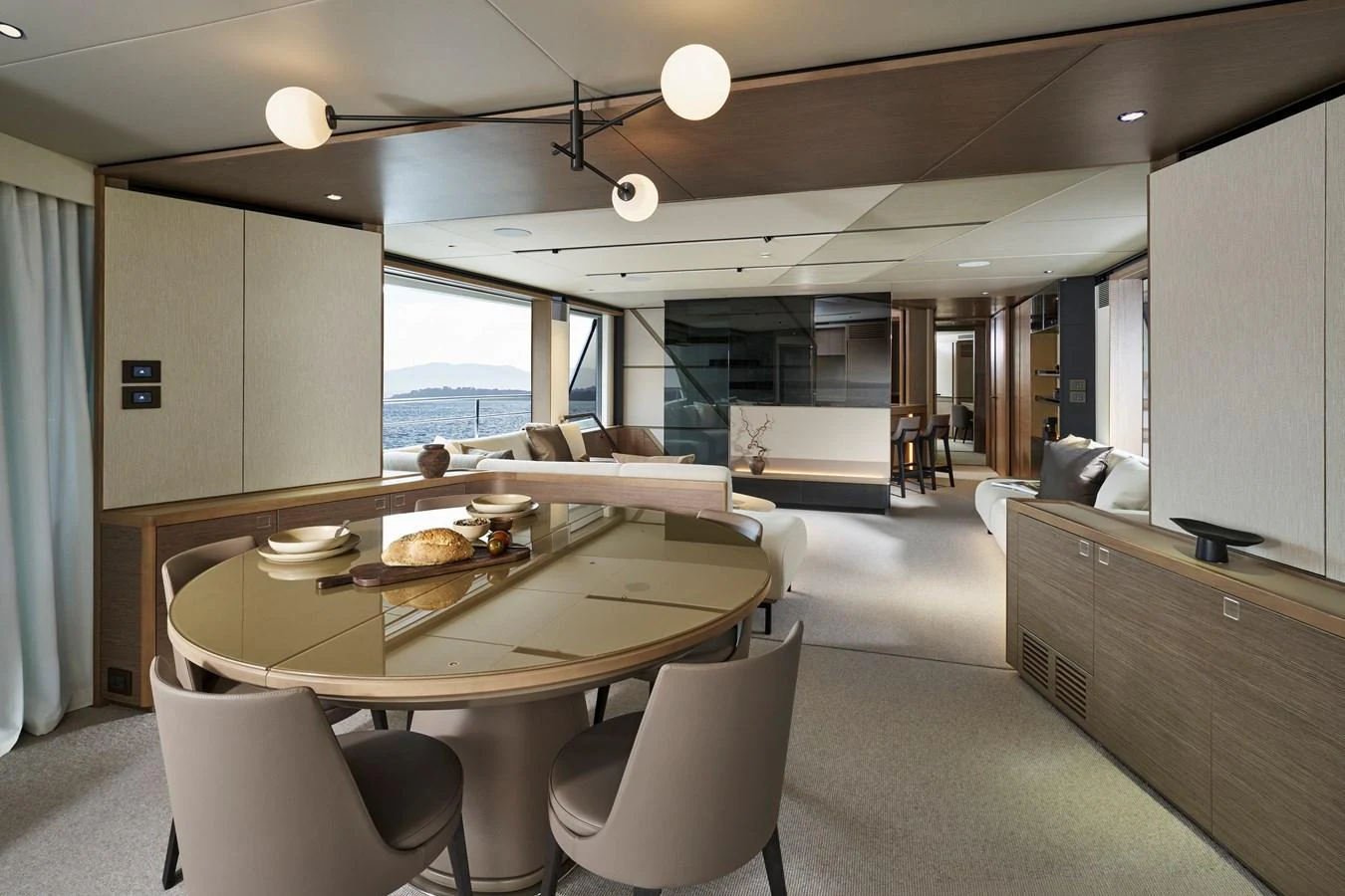 The salon features a modern dining area with elegant furnishings and ample natural light. aboard PRINCESS X90 Yacht for Sale