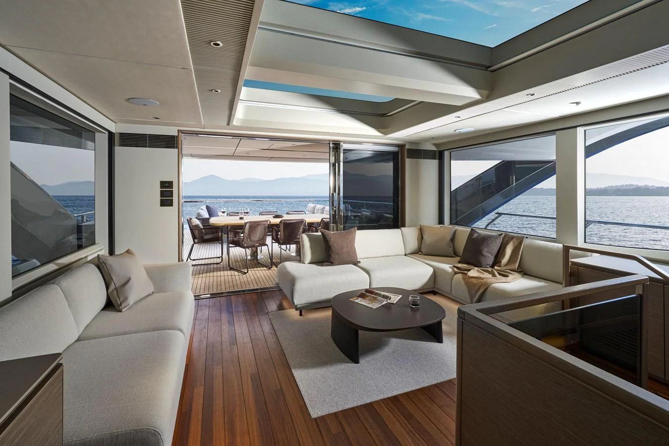 The salon offers a spacious and elegant area with ample seating and panoramic views. aboard PRINCESS X90 Yacht for Sale
