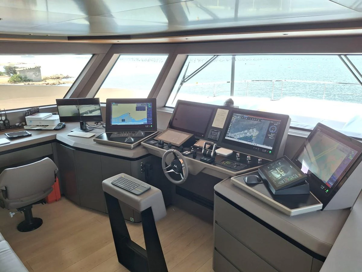 The helm station features advanced navigation equipment and a panoramic view of the sea. aboard ATALI Yacht for Sale