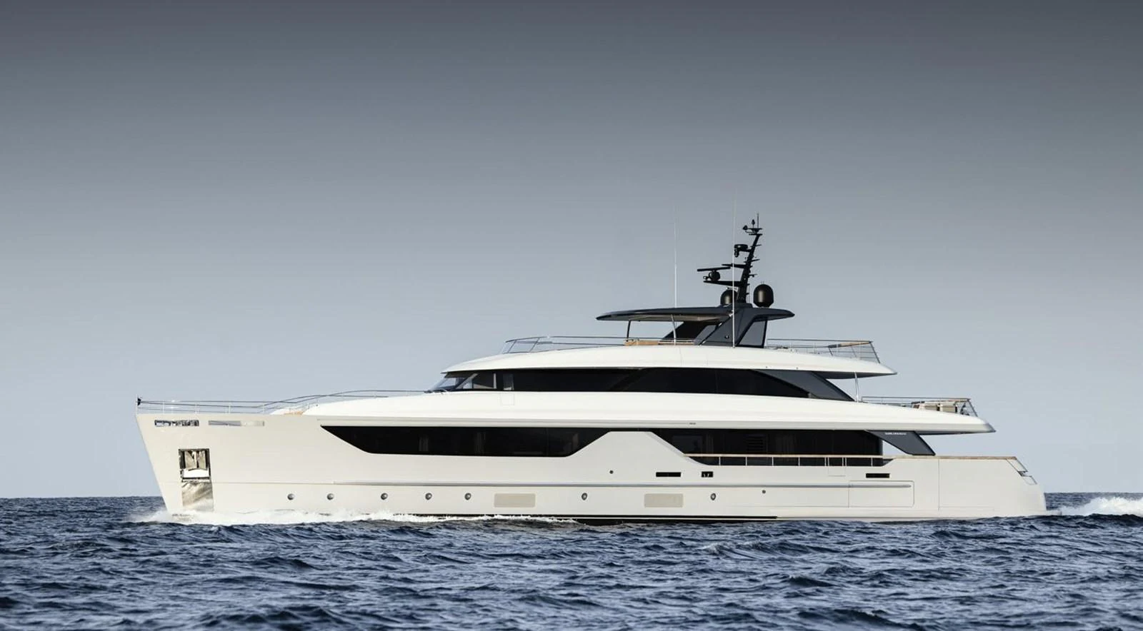 A sleek and modern yacht cruising on the open water. aboard TOO COOL Yacht for Sale