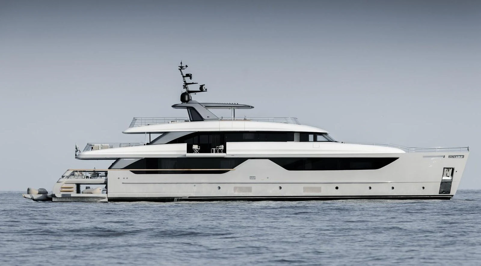 A sleek and modern yacht glides gracefully on calm waters. aboard TOO COOL Yacht for Sale