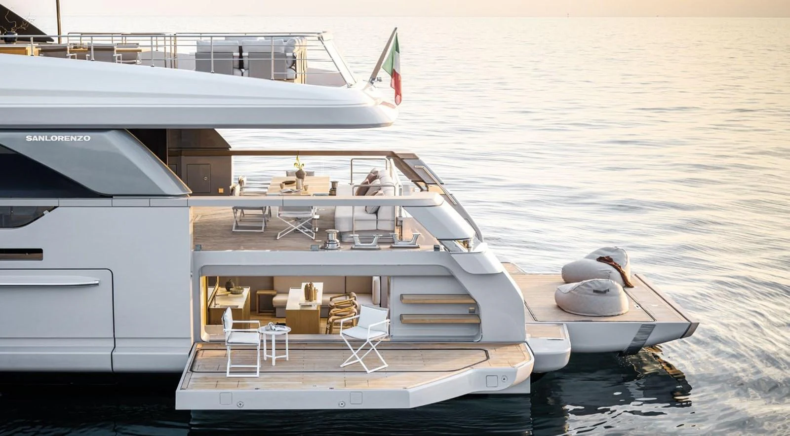 The yacht's aft deck features a luxurious lounging area with direct access to the water. aboard TOO COOL Yacht for Sale