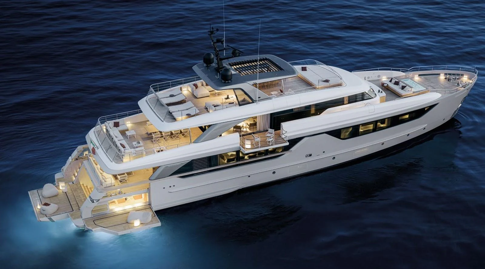 A luxurious yacht is illuminated beautifully against the evening sea, showcasing its elegant design and spacious decks. aboard TOO COOL Yacht for Sale