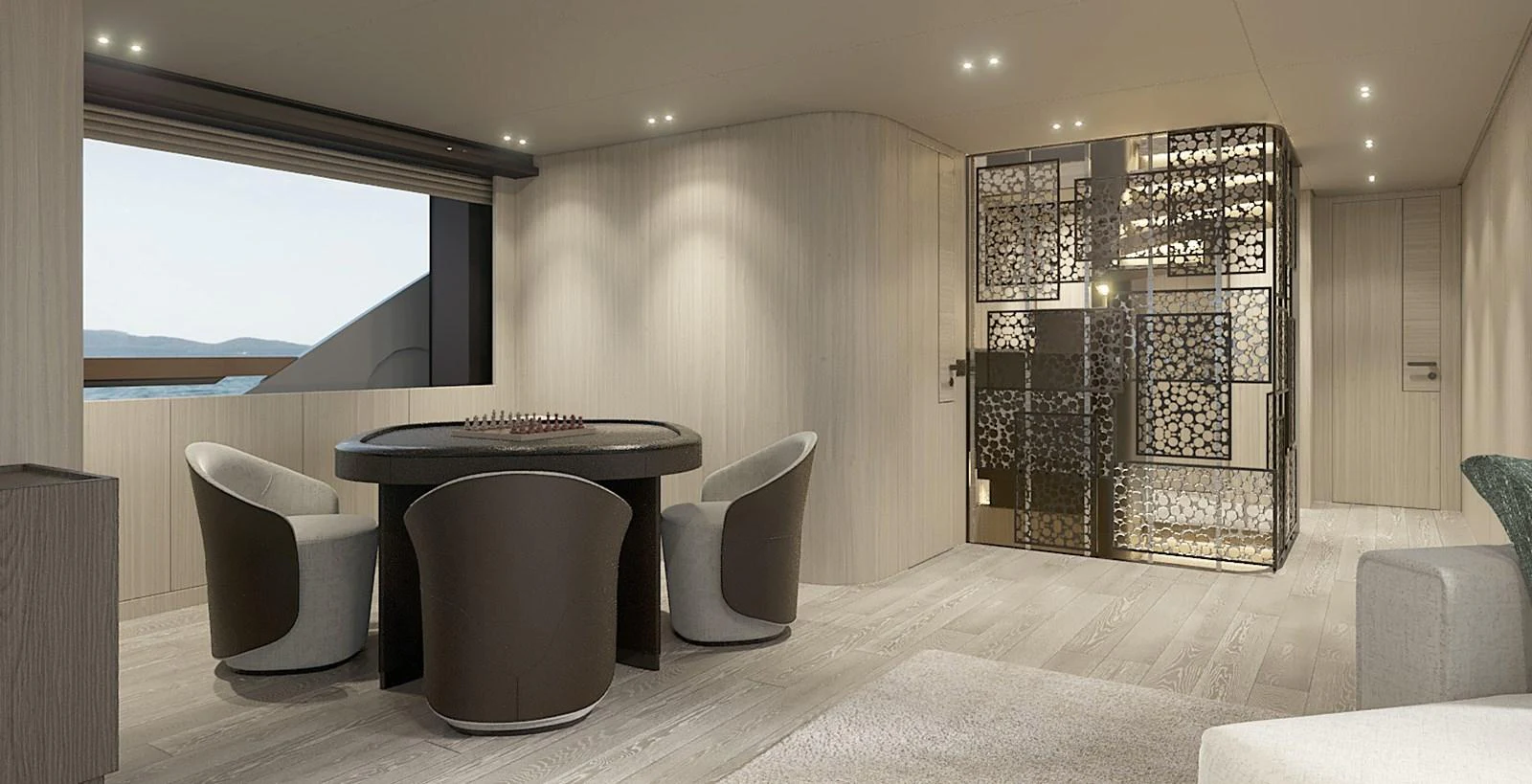 The salon features a modern design with a round table and comfortable seating, complemented by a decorative partition. aboard TOO COOL Yacht for Sale