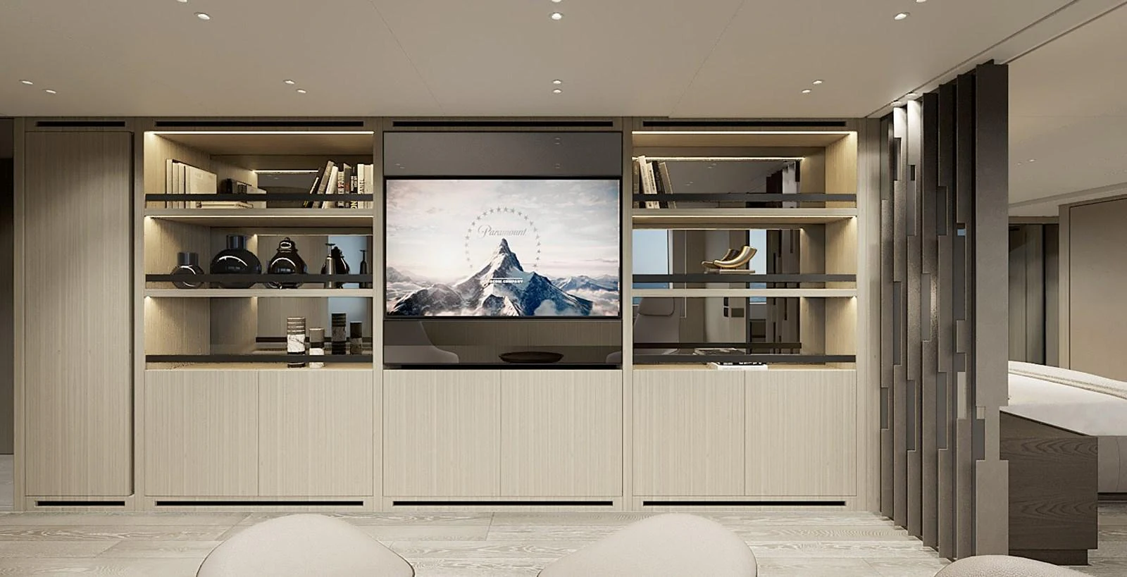 The yacht's interior features a modern entertainment area with a large flat-screen TV and stylish shelving. aboard TOO COOL Yacht for Sale