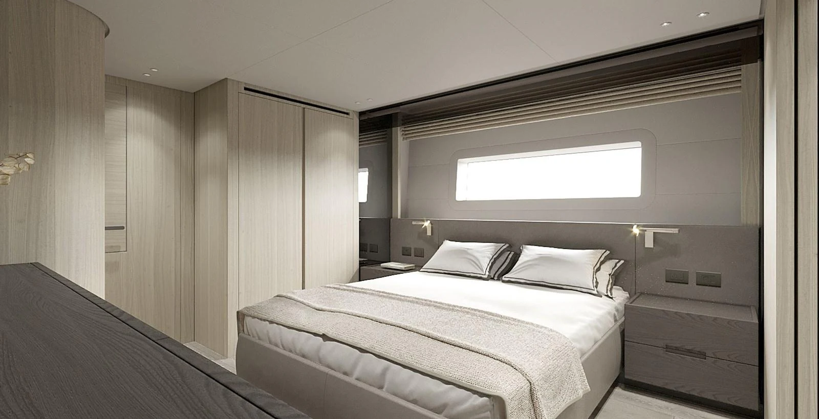 The master stateroom features a spacious bed and elegant wood finishes. aboard TOO COOL Yacht for Sale
