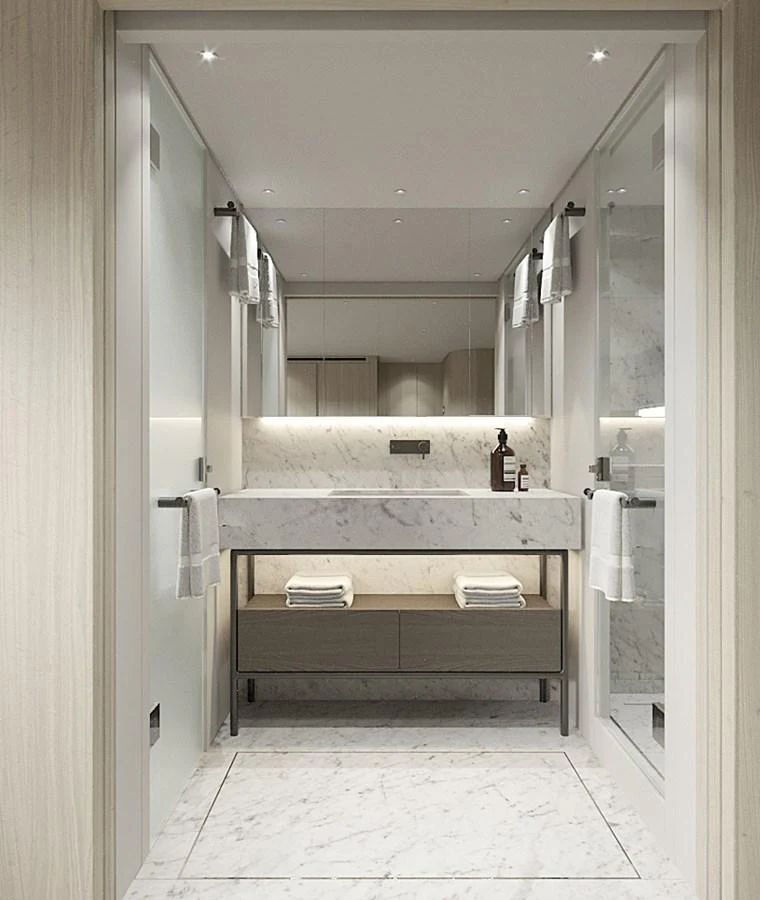 The yacht's bathroom features a sleek, modern design with marble accents and ample storage. aboard TOO COOL Yacht for Sale