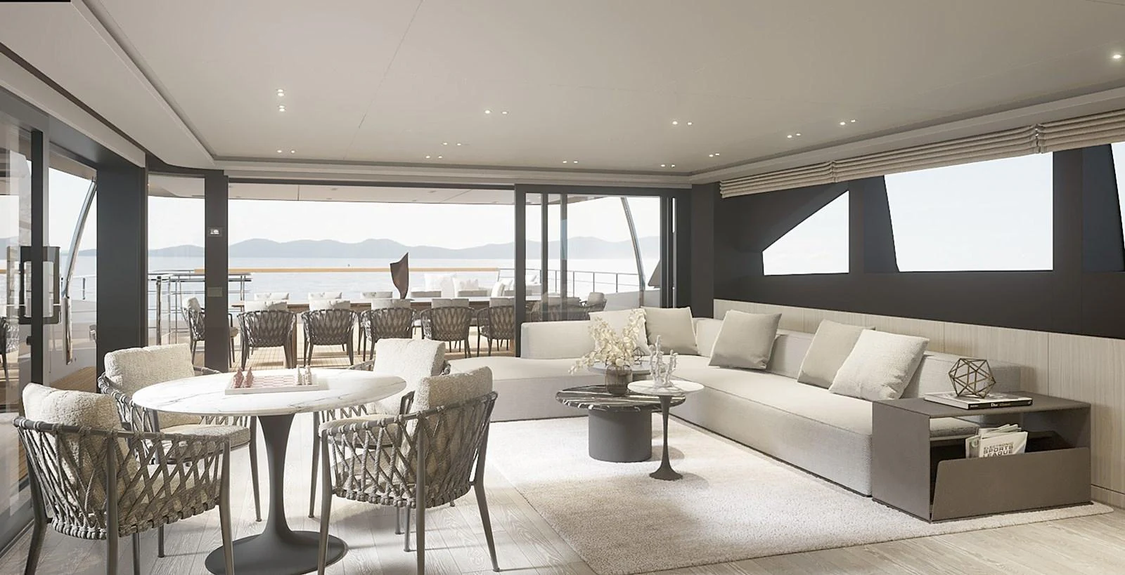 The spacious salon features modern furnishings and expansive windows offering stunning views. aboard TOO COOL Yacht for Sale