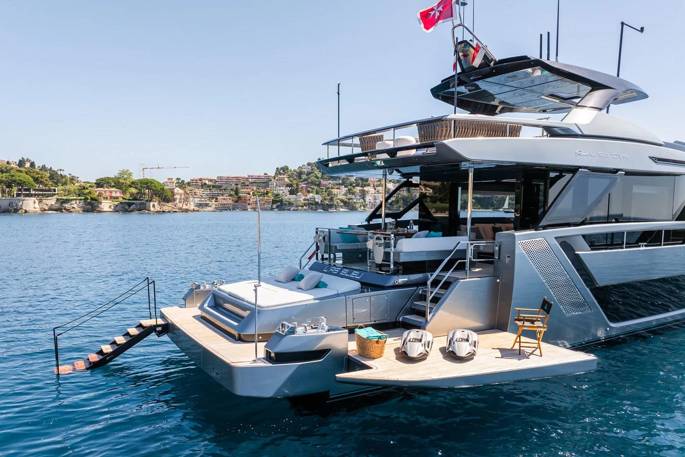 The yacht's aft deck features a spacious lounging area with easy access to the water. aboard L'AS BLEU Yacht for Sale