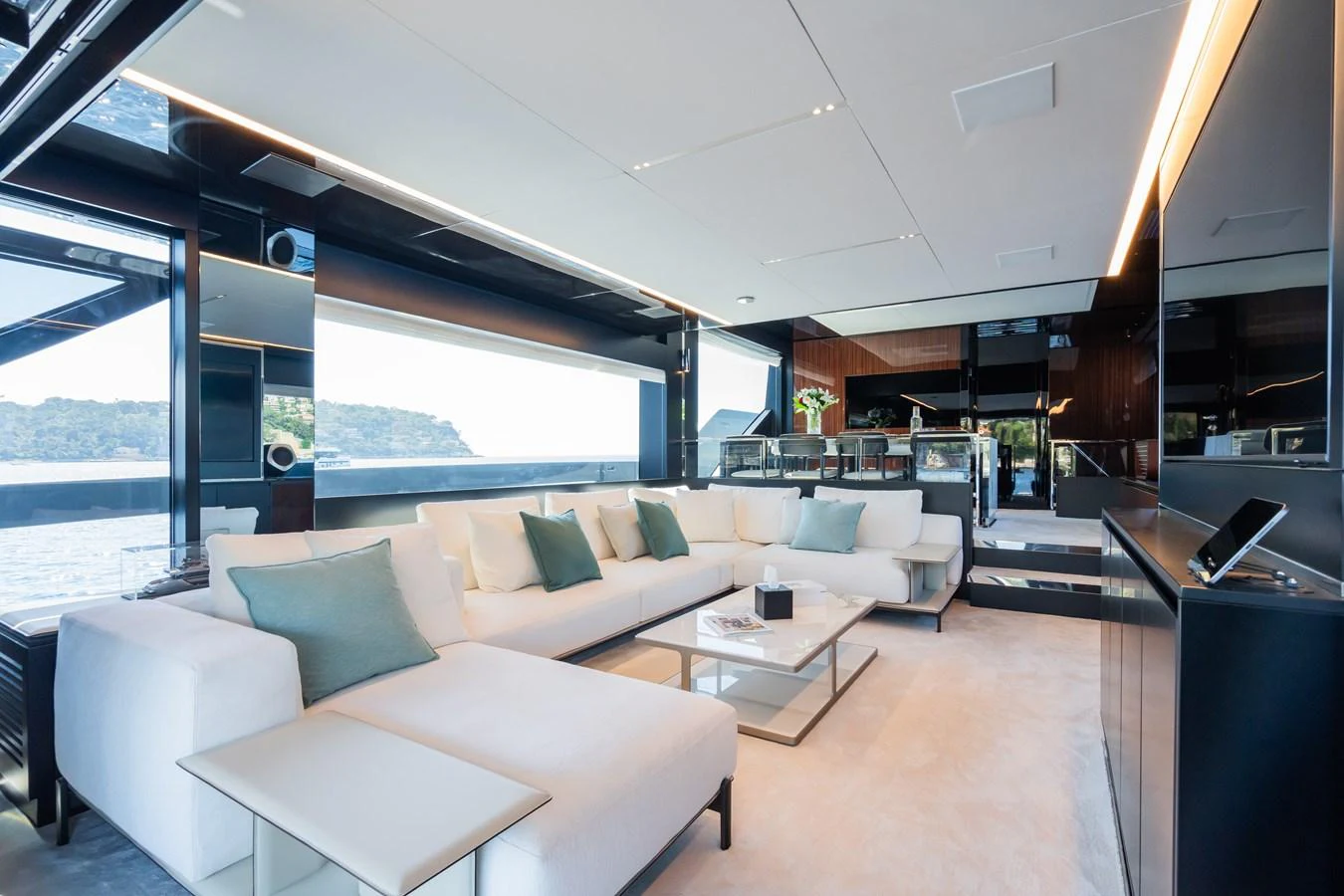 The salon features a spacious and elegant seating area with panoramic views. aboard L'AS BLEU Yacht for Sale