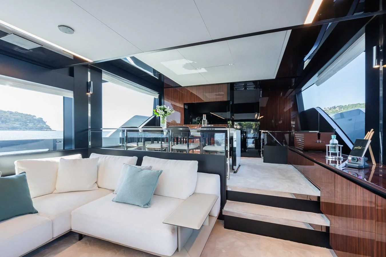 The yacht's salon features a modern, open layout with luxurious seating and elegant finishes. aboard L'AS BLEU Yacht for Sale