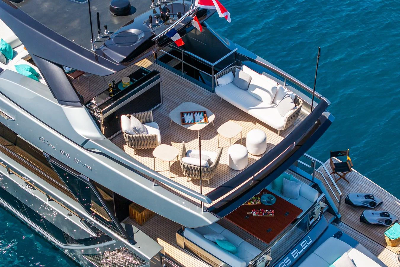 The sundeck of this yacht offers luxurious lounging areas with elegant furnishings and a stunning view of the water. aboard L'AS BLEU Yacht for Sale