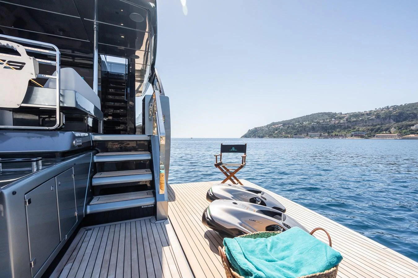 The aft deck offers a serene setting with water toys and a comfortable seating area, perfect for relaxation and enjoyment. aboard L'AS BLEU Yacht for Sale