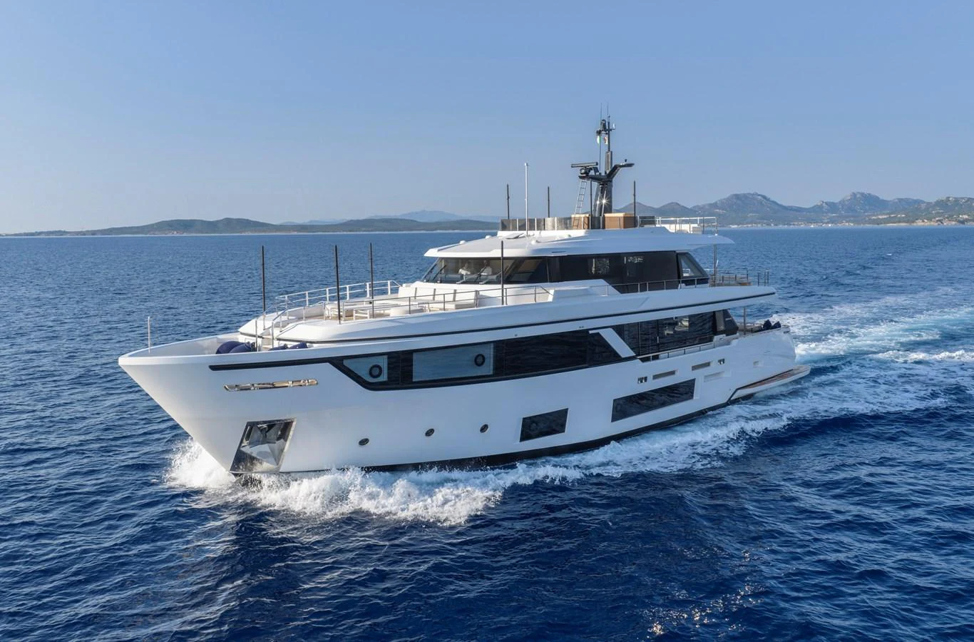 A sleek and modern yacht cruises through clear blue waters, showcasing its elegant design and spacious decks. aboard CLAIRE DE LUNE Yacht for Sale