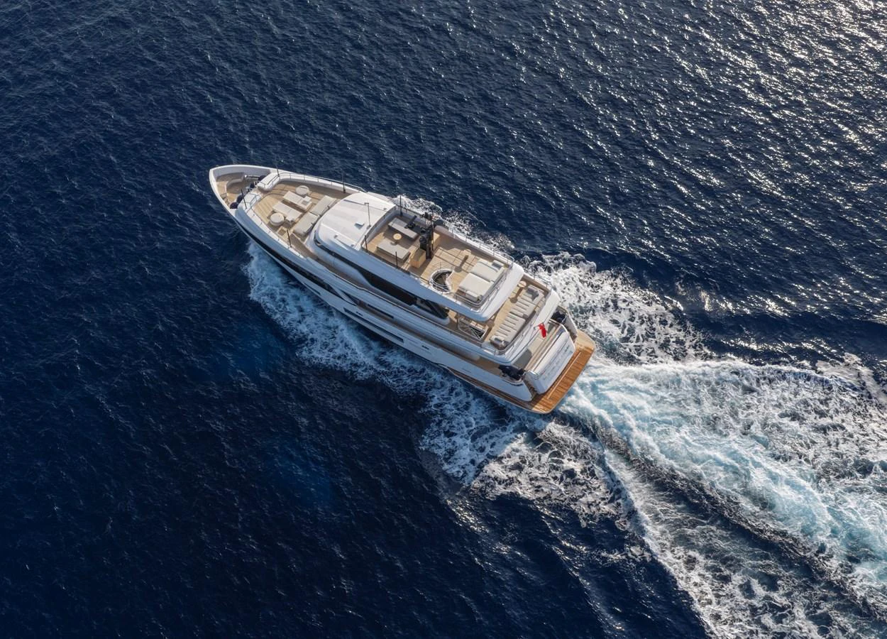 A luxurious yacht cruises through the open sea, showcasing its elegant design and spacious decks. aboard CLAIRE DE LUNE Yacht for Sale