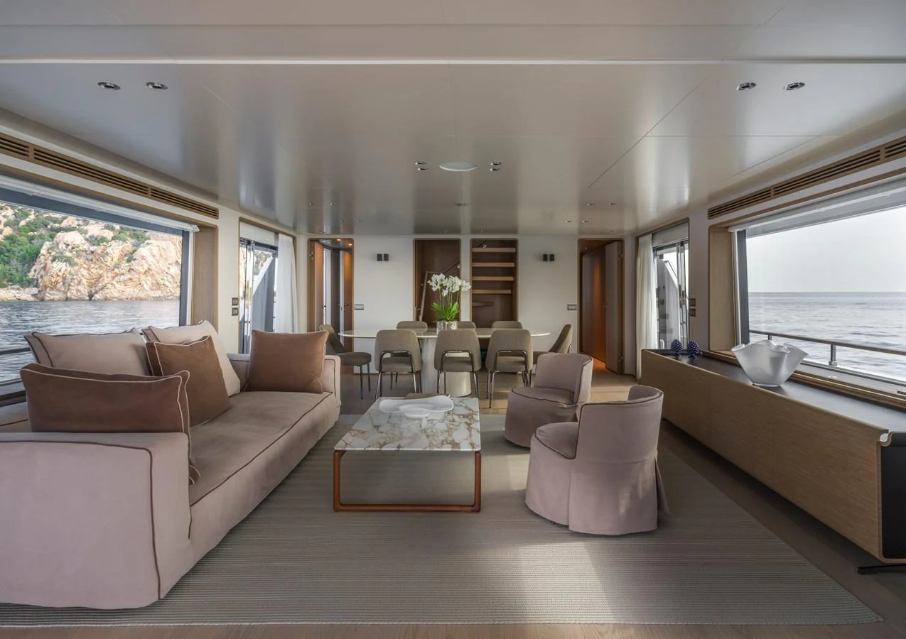 The yacht's salon features a spacious and elegantly furnished seating area with panoramic views. aboard CLAIRE DE LUNE Yacht for Sale