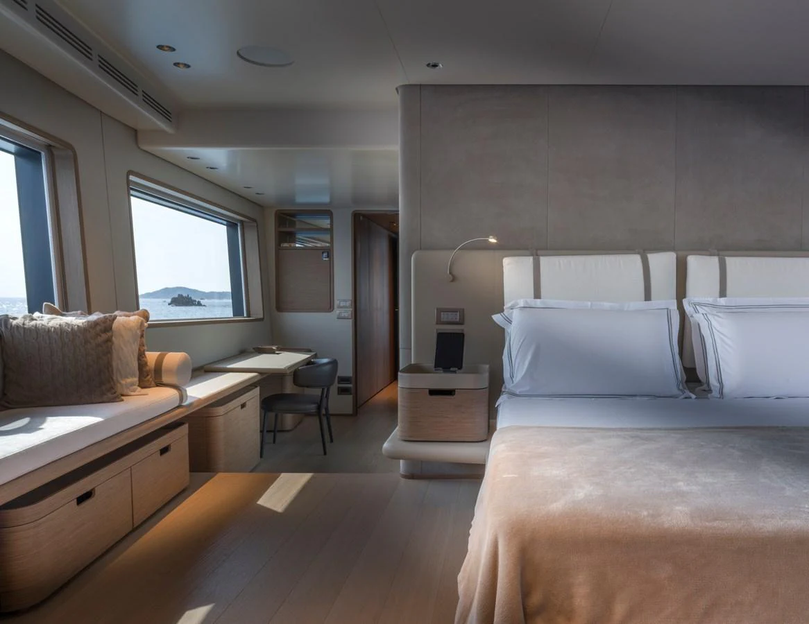 The stateroom offers a serene and luxurious retreat with ample natural light and elegant furnishings. aboard CLAIRE DE LUNE Yacht for Sale