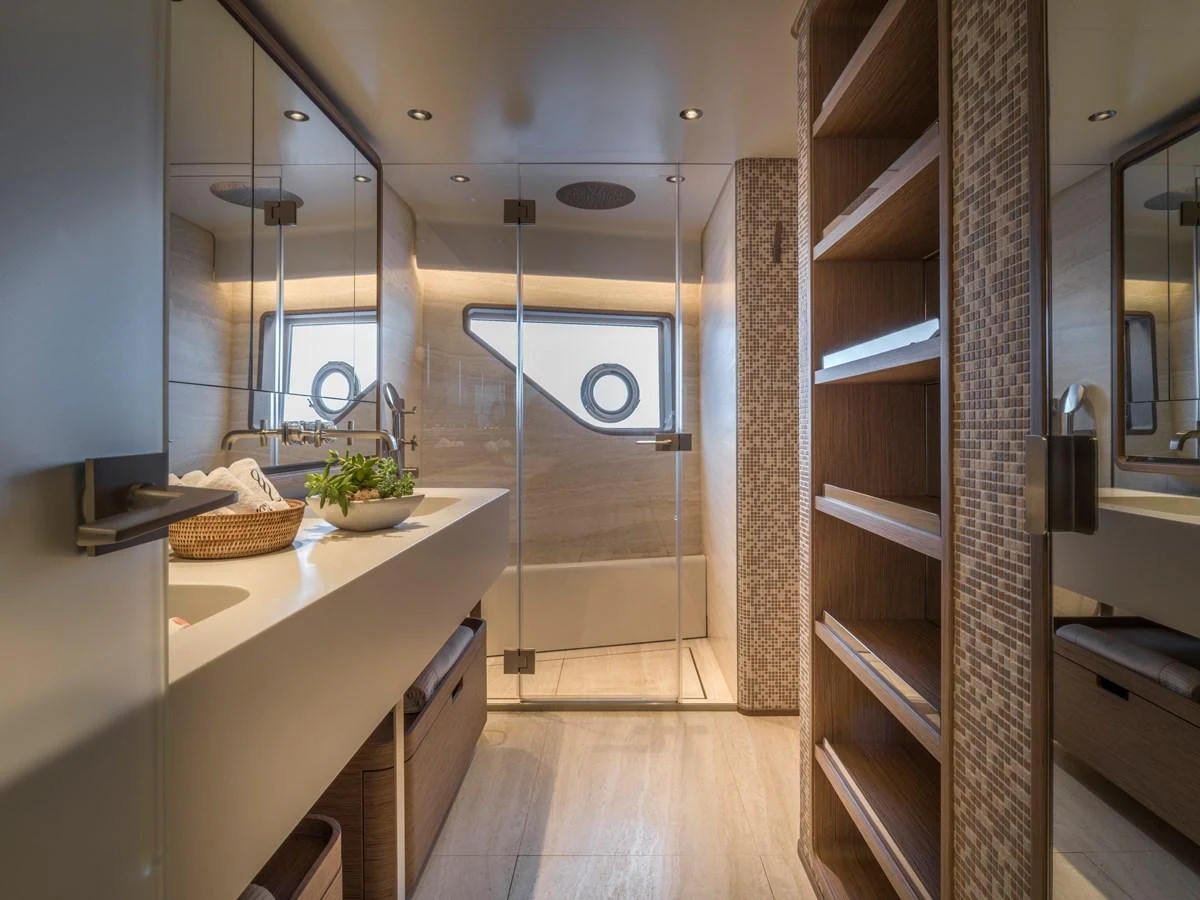 The yacht's bathroom features modern fixtures and a spacious shower area with elegant design elements. aboard CLAIRE DE LUNE Yacht for Sale