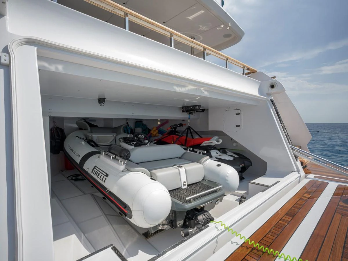 The yacht features a spacious garage with a tender and jet ski, ready for water adventures. aboard CLAIRE DE LUNE Yacht for Sale