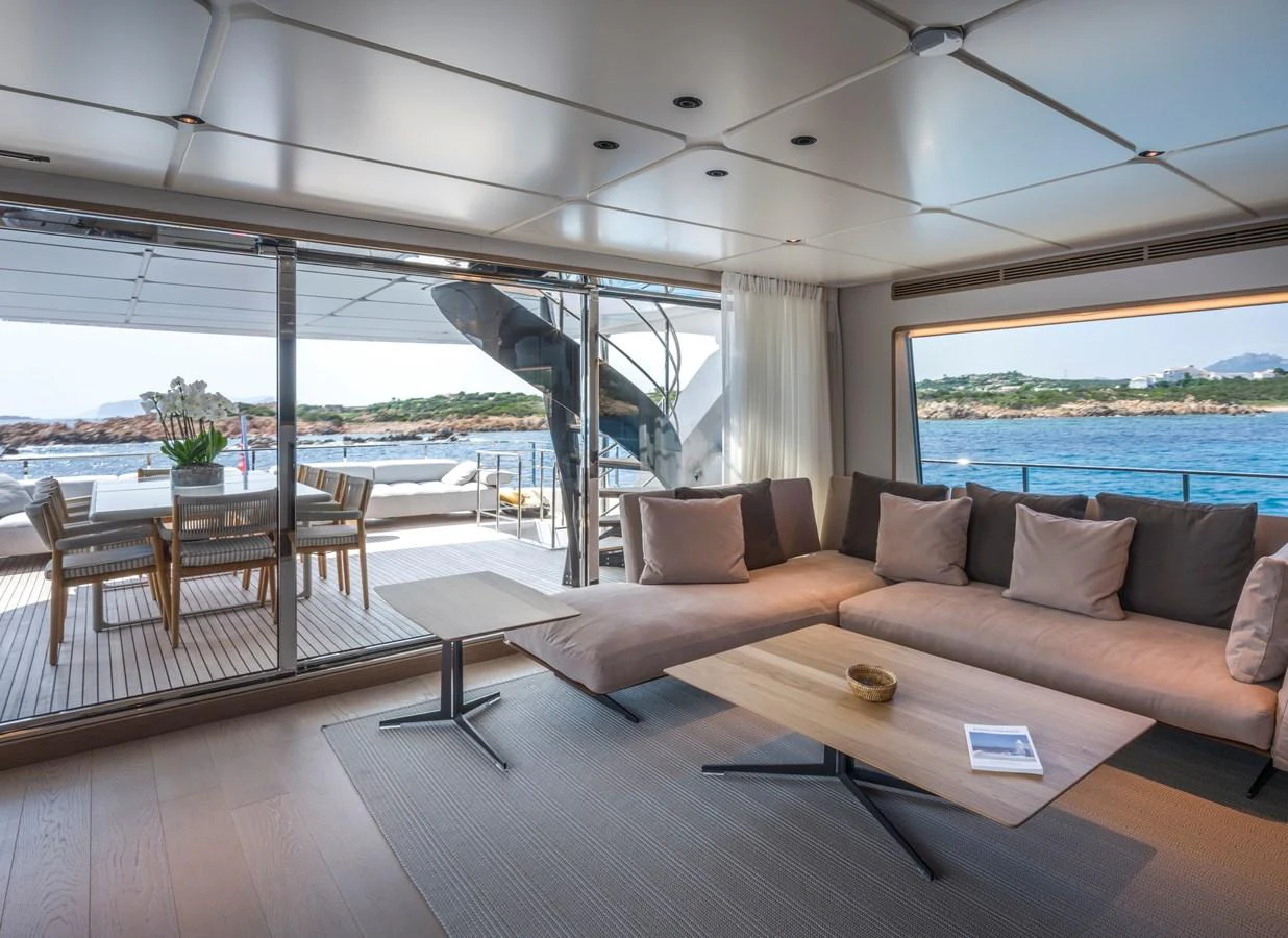 The salon offers a comfortable seating area with a view of the deck and surrounding waters. aboard CLAIRE DE LUNE Yacht for Sale