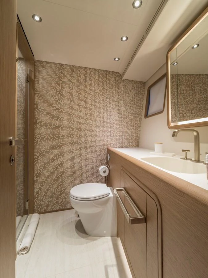A modern yacht bathroom with elegant fixtures and a stylish design. aboard CLAIRE DE LUNE Yacht for Sale